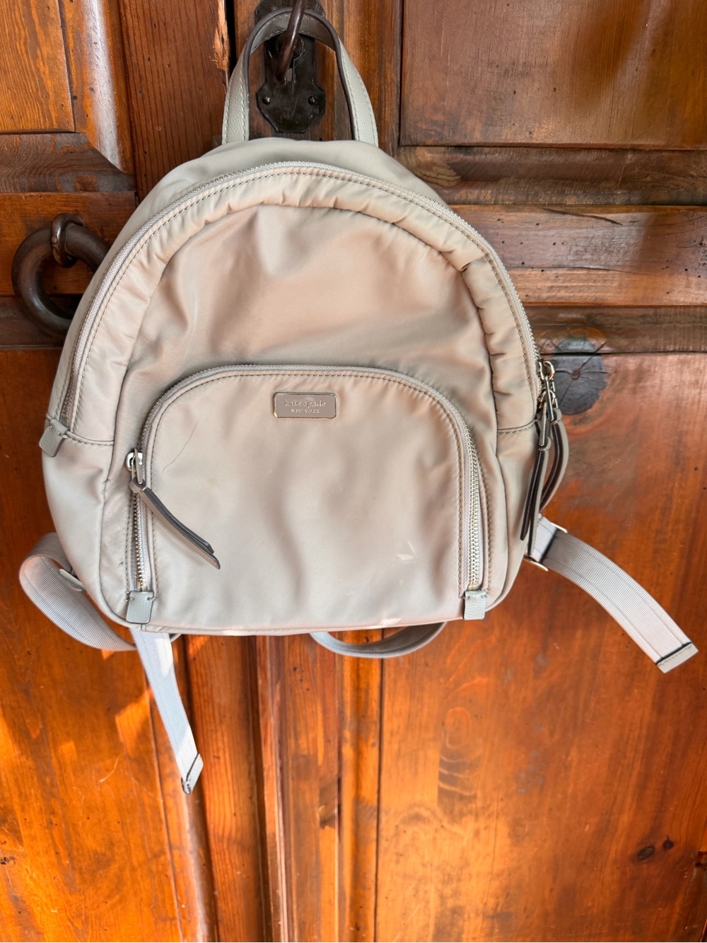 kate spade beige nylon mini backpack with front zip pocket